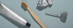 tongue scraper, toothbrush and tooth paste